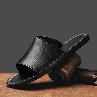 Herrtofflor i äkta läder med korsad baksida