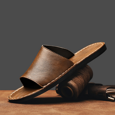 Herrtofflor i äkta läder med korsad baksida