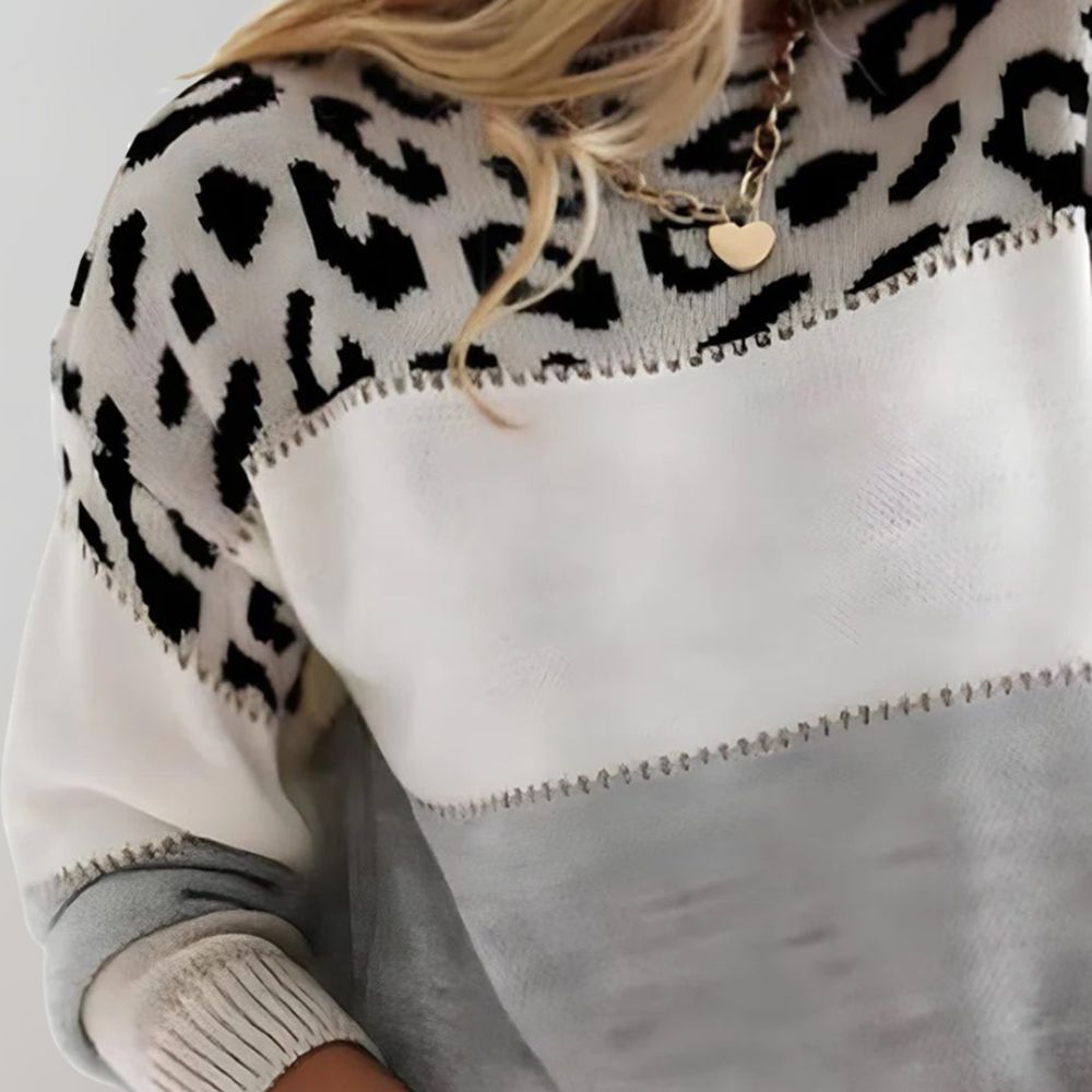 Gestreifter Pullover mit Leopardenmuster und Farbblöcken