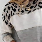 Gestreifter Pullover mit Leopardenmuster und Farbblöcken