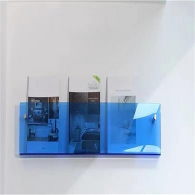 Estante de pared con revistero de acrílico transparente